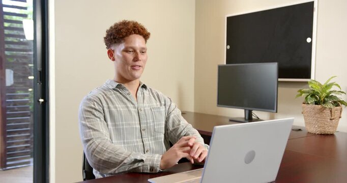 Lifestyle videos indoor of people doing activities at office, typing on laptop, young man working fr