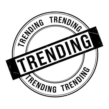 Circular stamp with the word trending repeated in a distressed style
