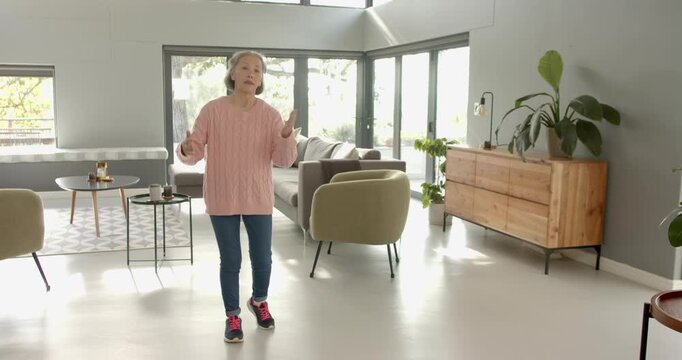 Close up of people talking to the camera, at home, elderly woman in living room