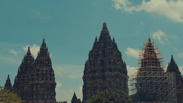 Majestic Stone Monuments of Prambanan Under Cloudy Sky