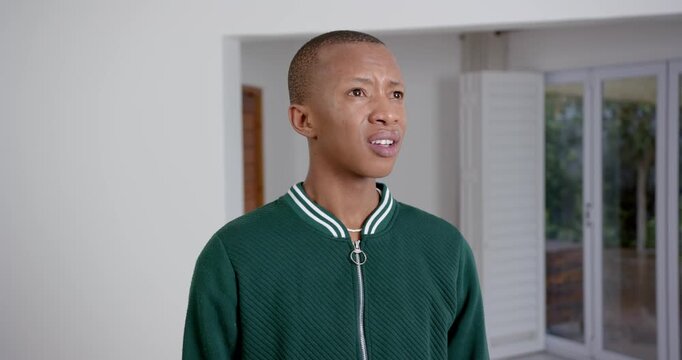 High speed photography for dynamic scenes, looking confused and concerned, man in green jacket stand