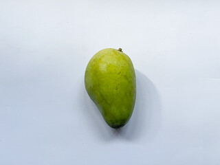 Fresh green mango isolated on a white background, showing smooth natural skin and an unripe appearance, suitable for food, nutrition, agriculture, tropical fruit, cooking, and healthy eating concepts. © nensa