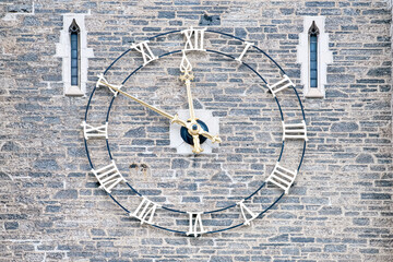 Obraz premium Roman numeral clock in a colonial style wall, Toronto