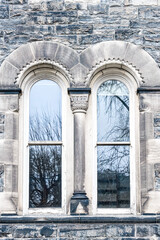 Obraz premium Colonial arched windows in stone wall, Toronto