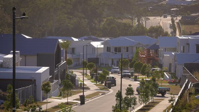 Morning, sunrise view down a street in the SkyRidge development at the base of the Gold Coast hinterland, Queensland, Australia