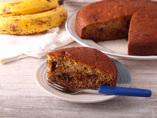 Slice of banana and chocolate cake on plate © manyakotic