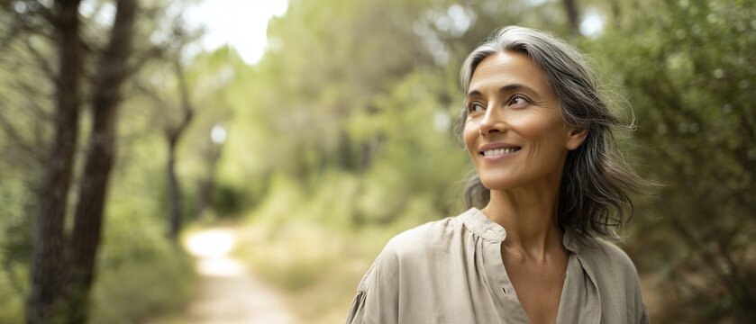 Portrait of Middle Aged Woman Walking in Forest Path