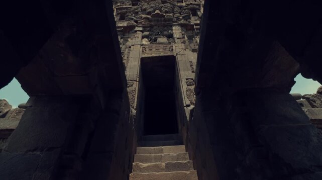 Dark Entrance and Stone Steps of Ancient Hindu Temple Ruins