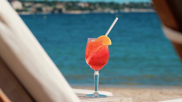 Aperol Spritz Cocktail With Orange Slice Over Mediterranean Sea Background