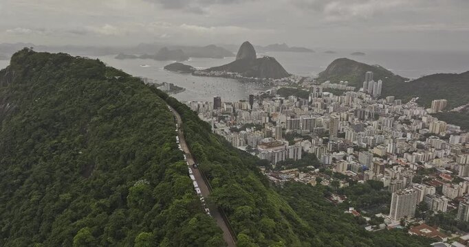 Rio de Janeiro Brazil Aerial v11 flyover along forested ridge of Mirante Dona Marta capturing Botafogo cityscape, Guanabara Bay and Sugarloaf mountain - Shot with 5k Camera - Mar 25th 2024