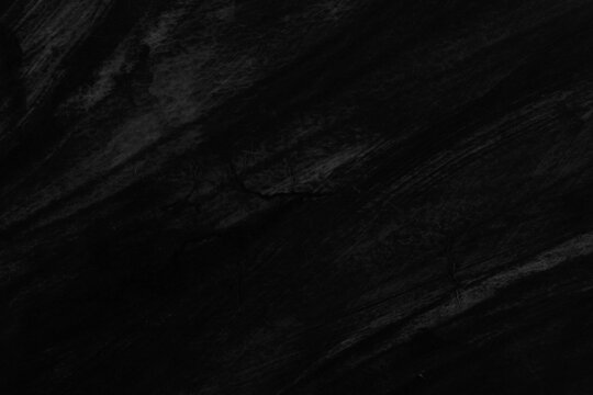 Dark black abstract background texture with subtle diagonal grain lines and fine crack details. Minimalist charcoal backdrop for luxury presentation, product promo, and cover.