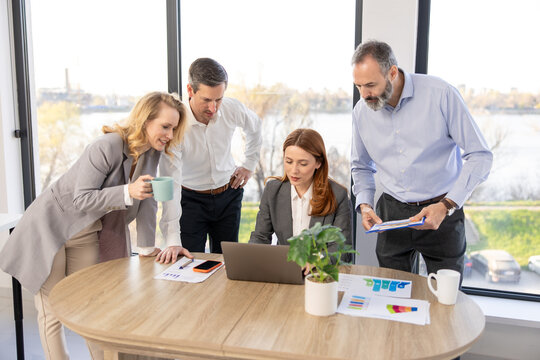 Group of business people working together around office desk