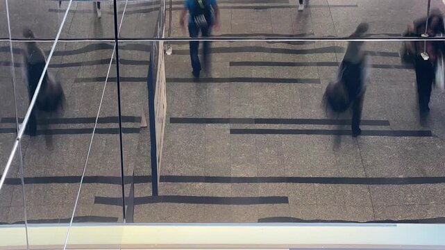 Commuters and Crowded Urban Crowd Reflected On Glass Wall During Rush Hour Transit timelapse