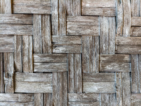 Old woven bamboo texture background, vintage traditional Asian pattern, rustic weathered wooden wall design close up.