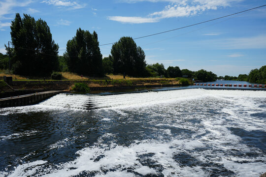 Stepped weir on a river on a sunny summer day
