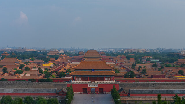 View of the Forbidden City with its iconic golden roofs, traditional red walls, and expansive courtyards under a clear sky in Beijing, Beijing, China.