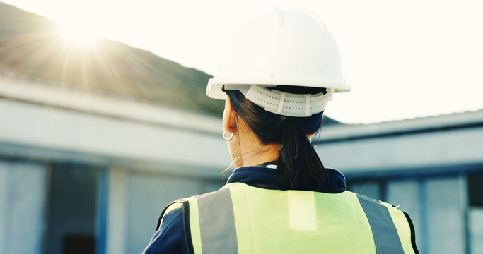 Construction, thinking or woman outdoor with back, progress track or mindset in building remodeling. Flare, space or supervisor with review, project reflection or operation plan on renovation site.