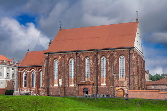 St. George's Church in Kaunas, Lithuania, historic side view. Gothic red brick architecture under bright daytime sky