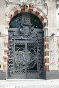 The ornate wrought-iron portal and arched entrance of the historic former commercial building "Am Bullenwinkel" on Hausvogteiplatz in Berlin-Mitte