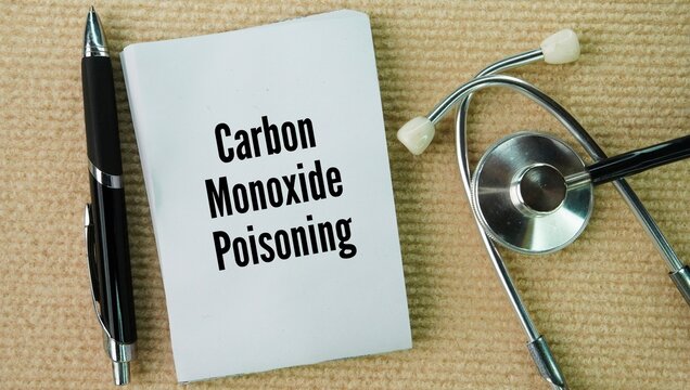 Stethoscope and paper with the words Carbon monoxide poisoning is a life-threatening condition that happens when you breathe in too much carbon monoxide gas, starving your body's vital organs of oxyge