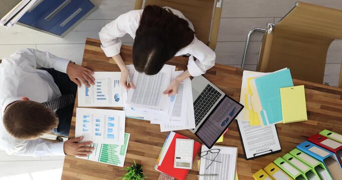 Department manager points out noticeable errors in report. Corporate report filled with elaborate graphs percentage figures and comparative tables