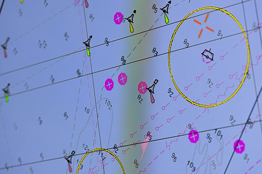 High-resolution electronic nautical chart screen showing marine navigation routes, buoys, depth contours, waypoints and highlighted safety zones for vessel routing, maritime planning, trafic control