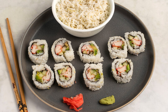 california sushi rolls served with a side pf rice