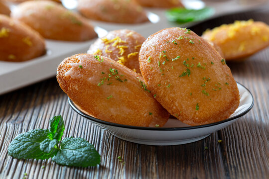 Delicious golden fried madeleines garnished with mint and lemon zest.