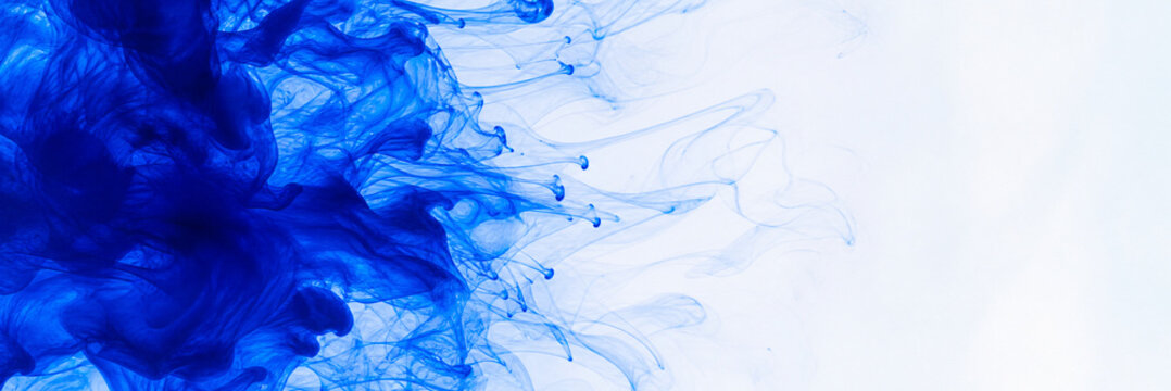 Blue ink swirls in water, abstract liquid smoke background, vibrant indigo dye cloud on white, artistic fluid motion for creative design