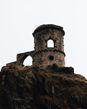 View of the historic Mow Cop Castle ruins perched on a rocky outcrop in Mow Cop, England, United Kingdom.