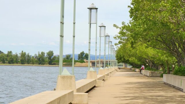People by the waterside edge