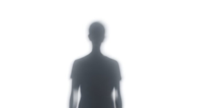 Blurred figure of a person standing against a bright white background creating a ghostly effect and sense of mystery