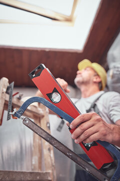 House painter and carpenter working on a home renovation.