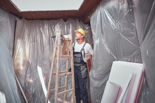 House painter and carpenter working on a home renovation.