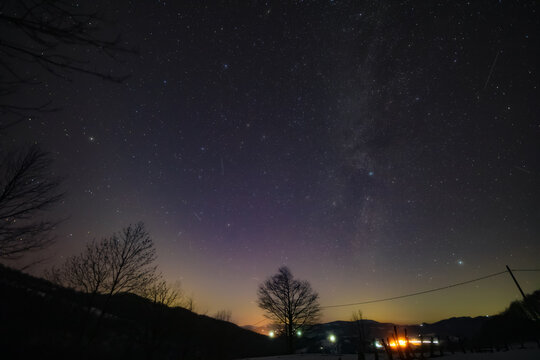 Orion constellation, zodiacal light and Milky Way stars on a dark countryside skies.