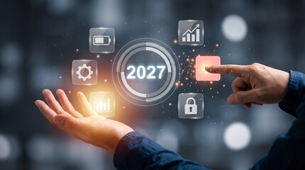 Obraz premium Businessman hand touching a digital holographic interface representing 2027 technology goals with future trends business strategy data technology cyber security future planning digital transforma