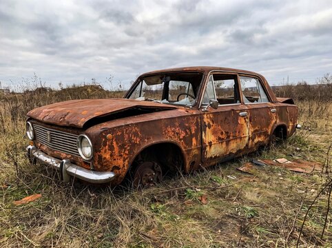 old car in the field rusty