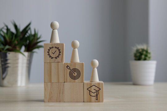 Goal achievement and career development with wooden block steps