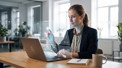 Fototapeta premium Professional businesswoman interacting with futuristic holographic interface, working on laptop in modern office, innovative technology for data analysis and business management
