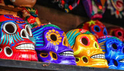 Fototapeta premium Colorfully painted skulls (Calaveras), used during the Day of the Dead celebrations, are seen sold on the market in Mexico City.