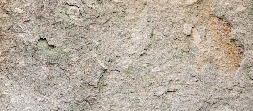 Rough weathered light beige stone texture background