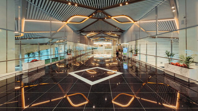 Bhogapuram, India - 22 August 2026: View of Alluri Sitarama Raju International Airport terminal with polished black marble floors, modern geometric lighting, and glass partitions.