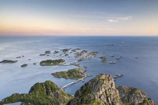 View of fishing village Henningsvaer from the top of Festv&aring;gtinden, Small islands connected by road and bridges, Austv&aring;g&oslash;ya, Lofoten, Norway