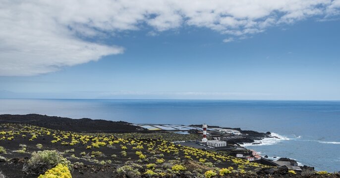 Coast with the Salinas Tenegu&iacute;a salt evaporation ponds, old and new lighthouse, on the southern cape of Punta de Fuencaliente, La Palma, Canary Islands, Spain