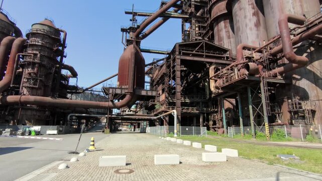 Wide view of historic blast furnaces, pipelines and steel structures at the Lower V&iacute;tkovice complex in Ostrava, Czechia.