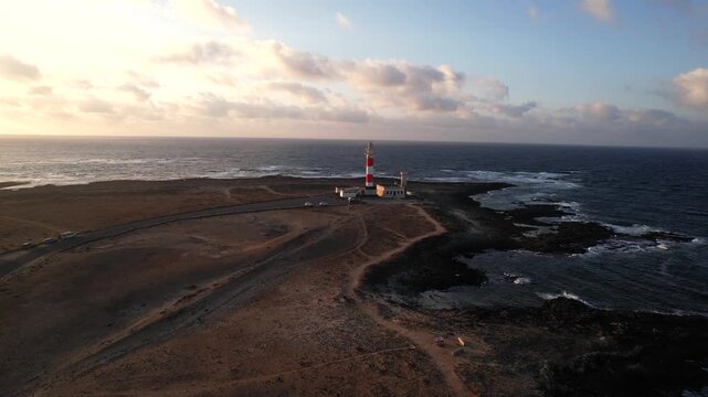 Beautiful lighthouse in the coast of El Cotillo, Fuerteventura. Aerial at sunset