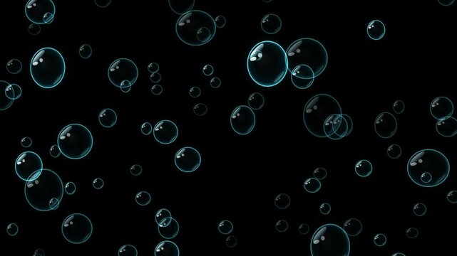 Transparent soap bubbles floating upwards on a black background