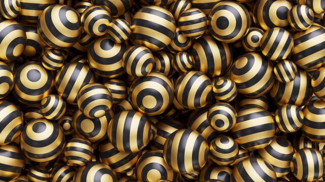 Smooth flowing lines forming mesmerizing sphere visuals. A dense pile of glossy black and gold striped spheres fills the frame, creating a vibrant, textured pattern.