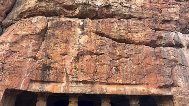 Vertical panning view of the ancient Badami rock-cut caves in Karnataka, India
