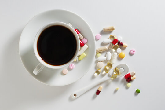 Coffee cup with various pills
